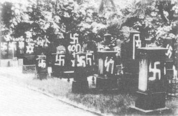 Gravestones in a Jewish cemetery in Mainz, western Germany, smeared with swastikas