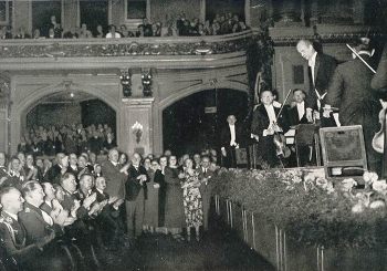 Furtwängler (upper right) acknowledges an applauding Hitler, who is seated with Goring and Goebbels