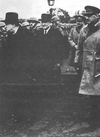 Prime Minister Churchill, left, accompanied by General Hobart, right, inspects the 11th Armoured Division in November 1941