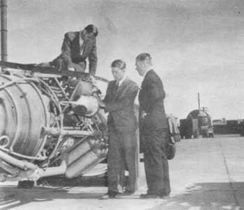 Martin Schilling, Wernher von Braun, Ernst Steinhoff inspect V-2 rocket motor, White Sands, NM, 1946
