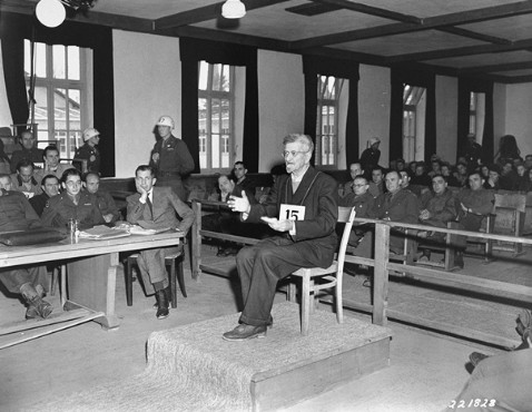Dr. Klaus Karl Schilling testifies during a U.S. show trial at Dachau after the war