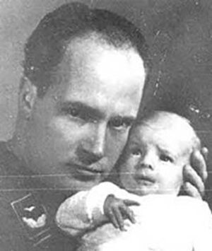Sigmund Rascher with one on the infants he and his wife abducted.