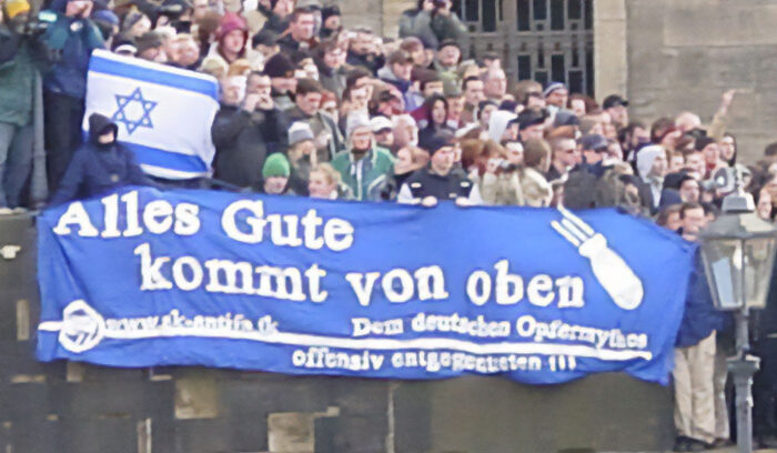 'Everything good comes from above' – meaning bombs. Demonstration in Germany against commemorating German war victims.