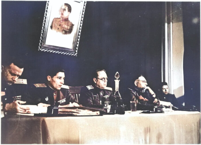 The Soviet judges’ bench at the Sachsenhausen Show trial, with Joseph Stalin keeping a watchful eye.