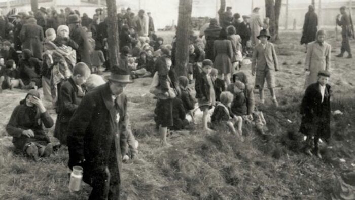 Jewish females with children and elderly persons from Hungary at Auschwitz, awaiting further “processing” in a grove at the western part of the camp. Note that none of these pictures show smoke of any fires, as the legend claims. (Auschwitz Album)