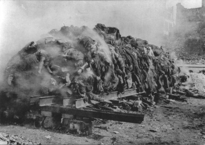 Dresden Altmarkt: Smoldering pile of corpses of German civilians killed during the Anglo-Saxon bombing raid.